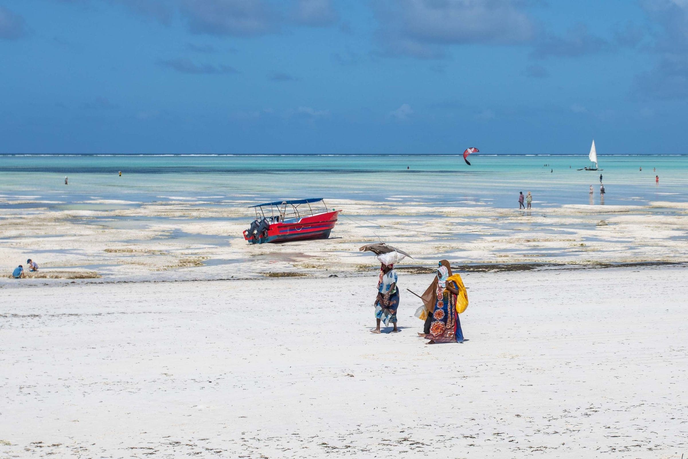 A red boat on the tidal flats of the Kenyan coast