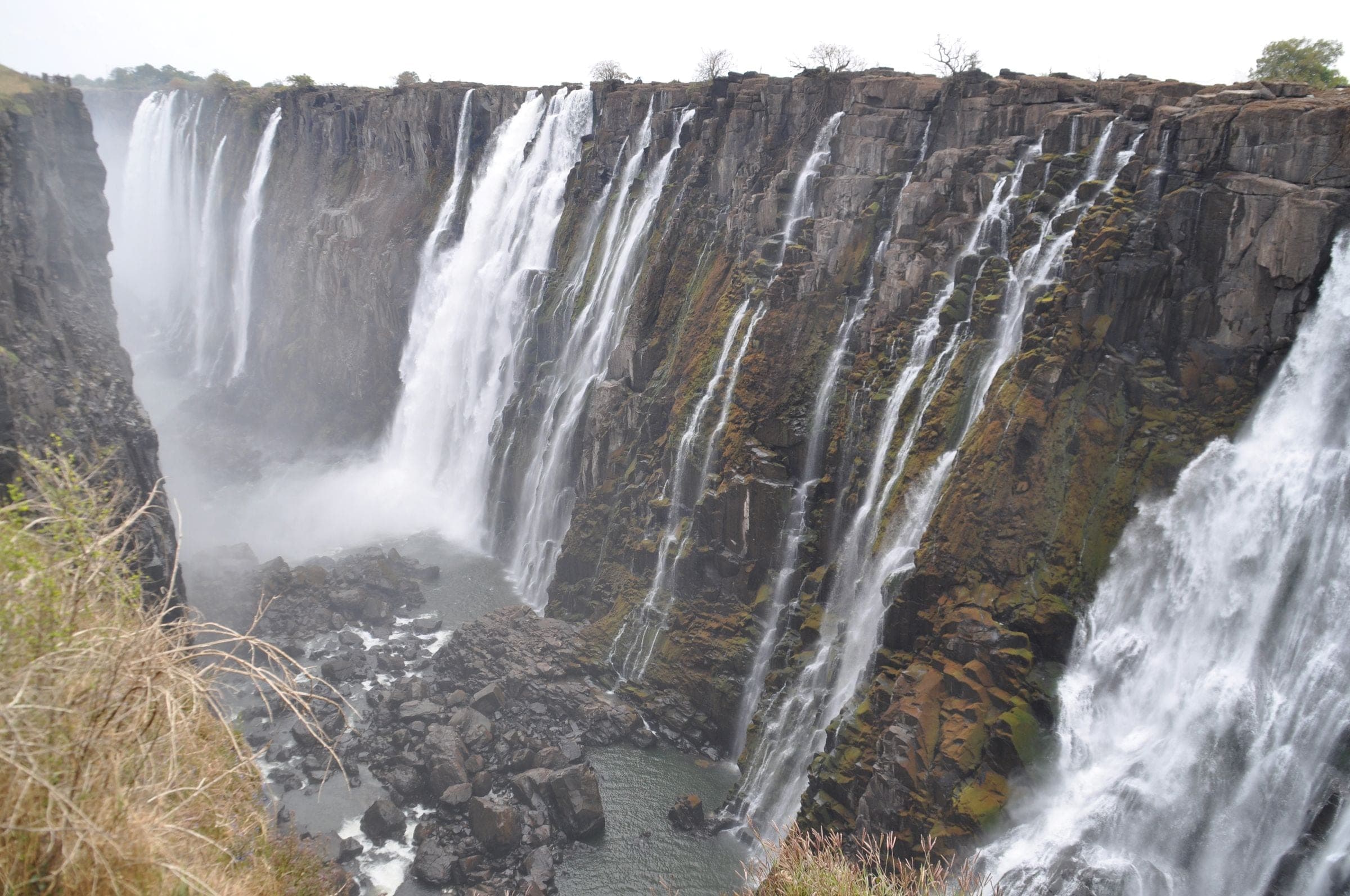 Victoria Falls pouring over the cliffs into the gorge