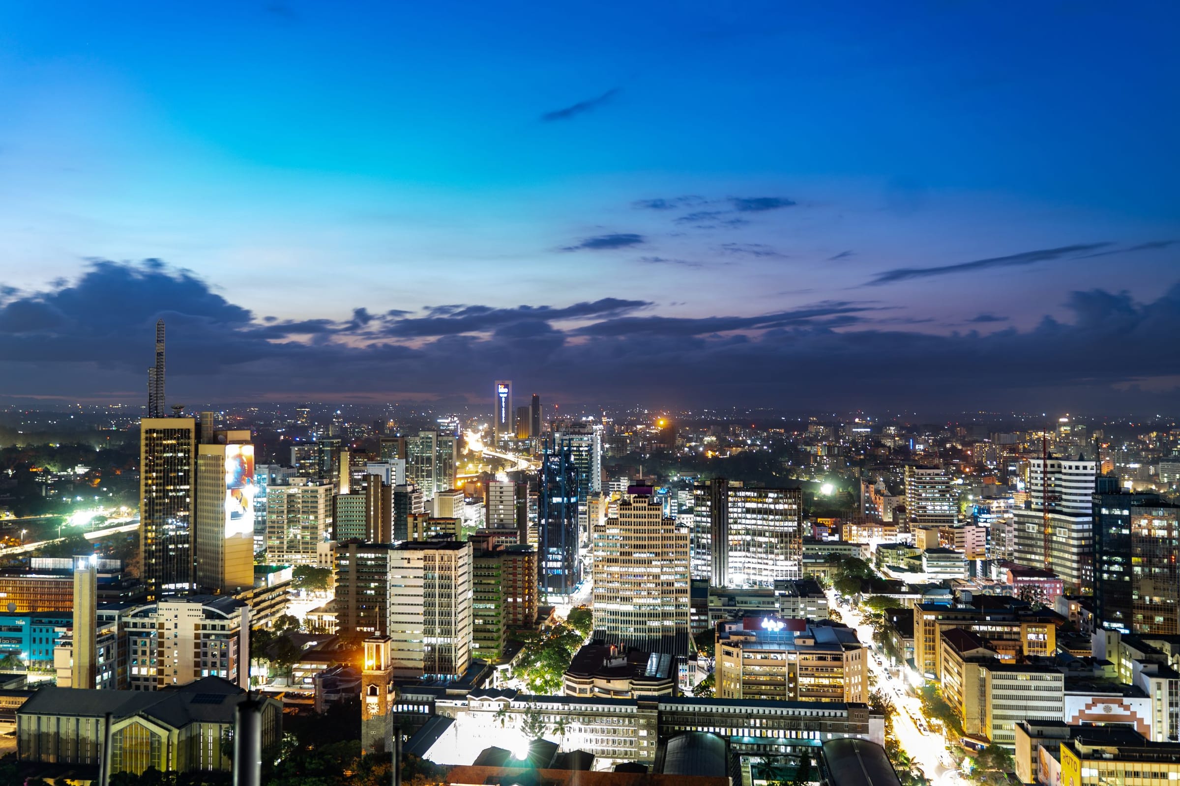 The Nairobi skyline lit up at dusk