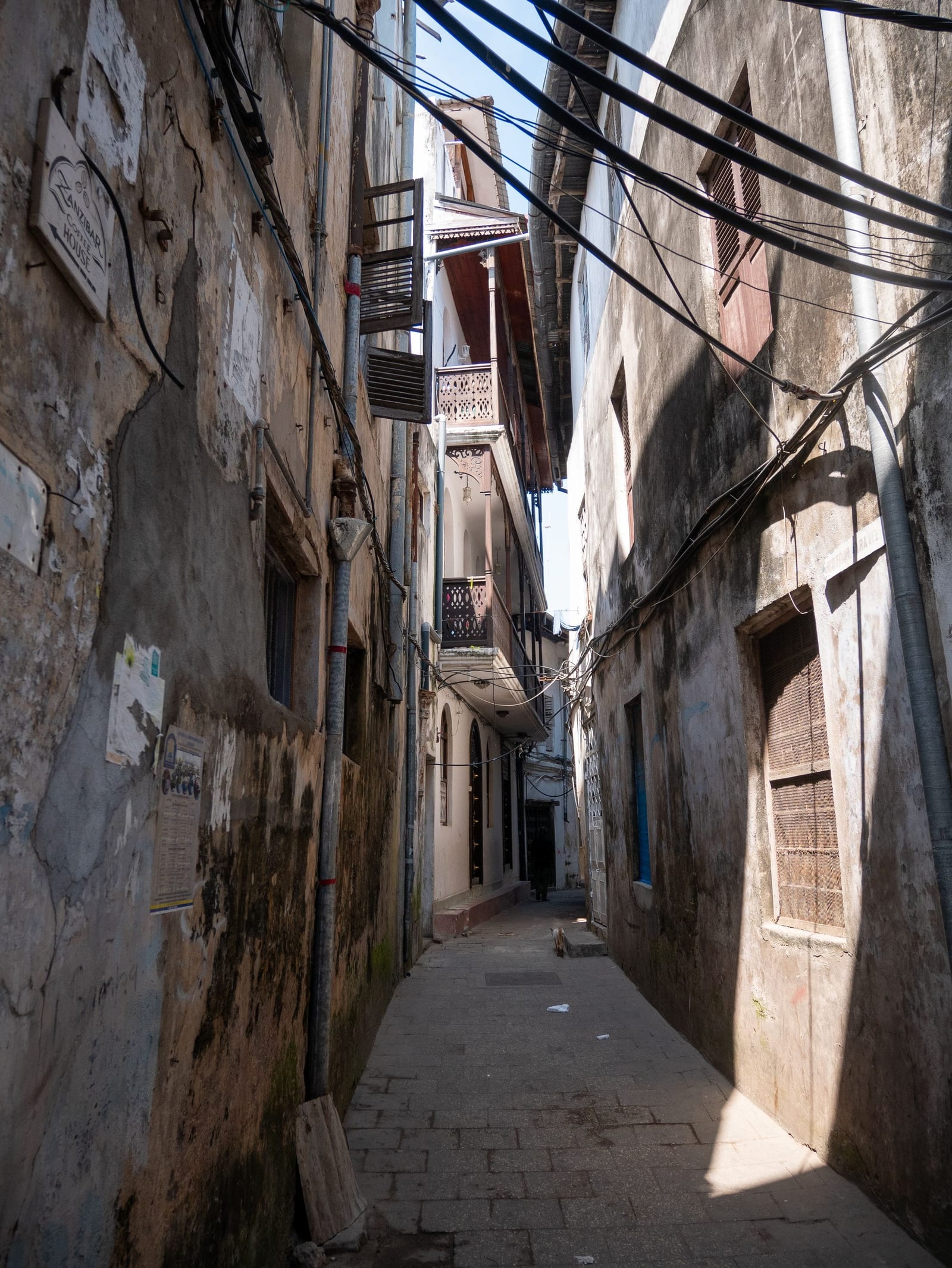 A narrow lane between old buildings in Stone Town