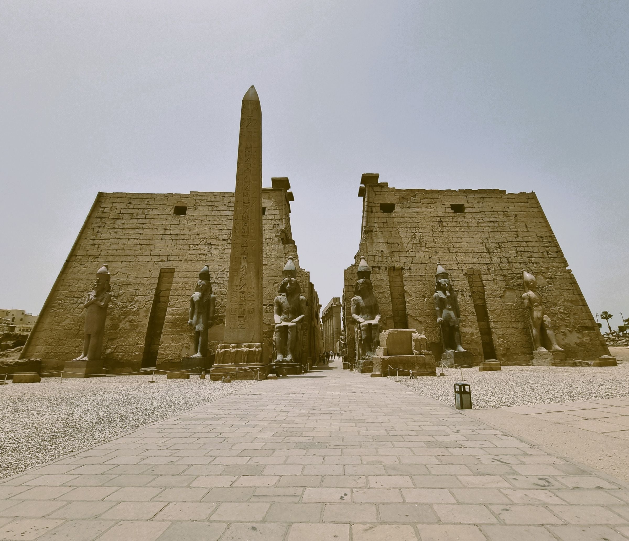 The obelisk and statues at the entrance to Luxor Temple